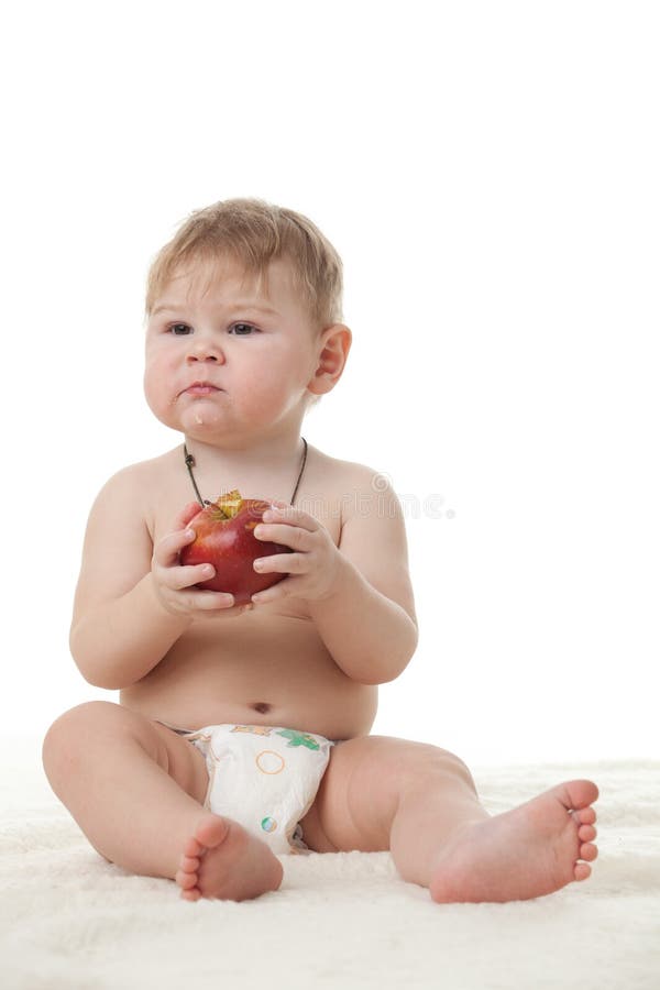 Sweet small baby with apple.