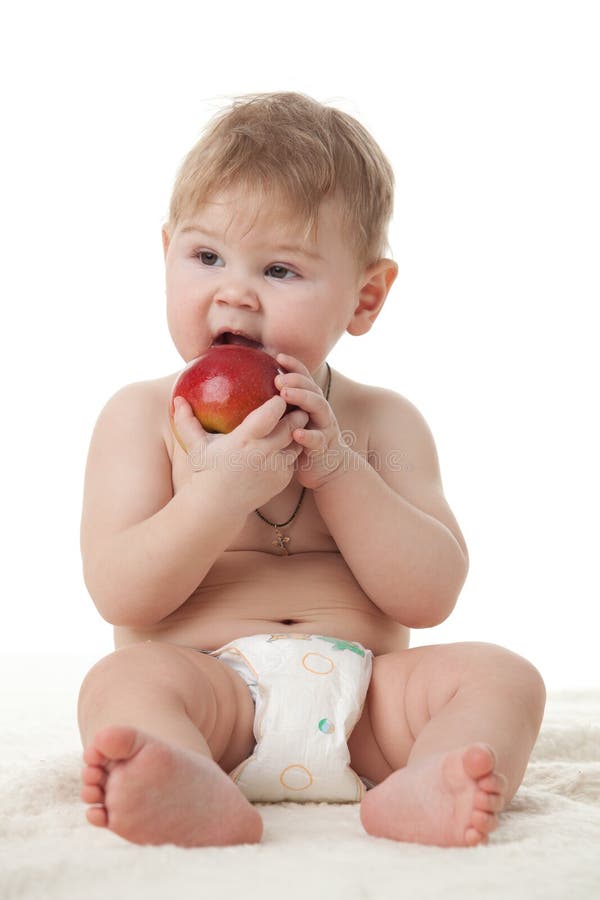 Sweet small baby with apple.