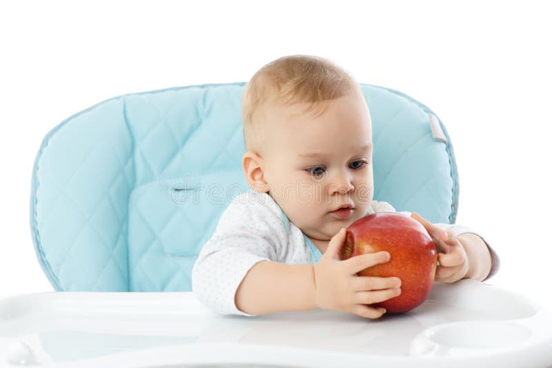 Sweet small baby with apple.