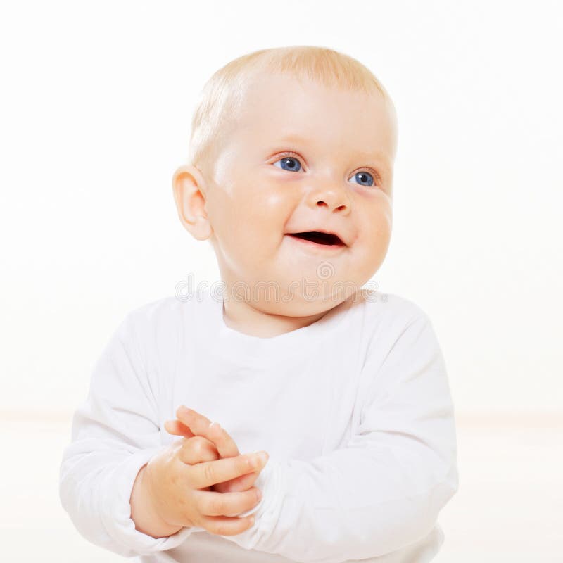 Sweet smiling baby with blue eyes stock photo Sweet smiling baby with blue eyes stock photo