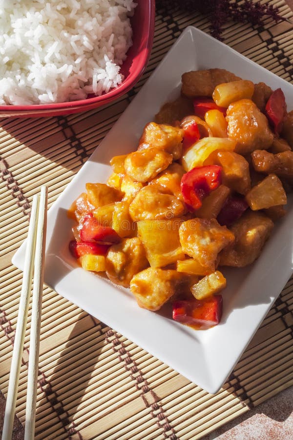 Sweet and Sour Chicken with Bell Pepper and Pineapple. White Rice on