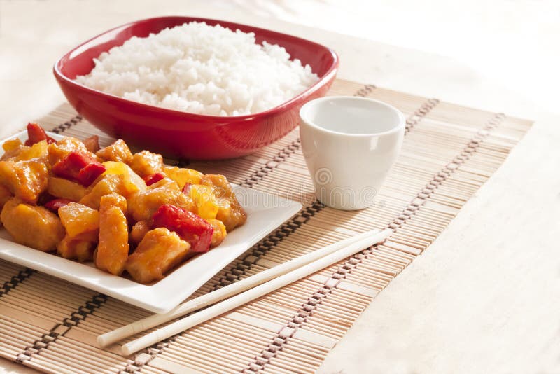 Sweet and Sour Chicken with Bell Pepper and Pineapple. White Rice on