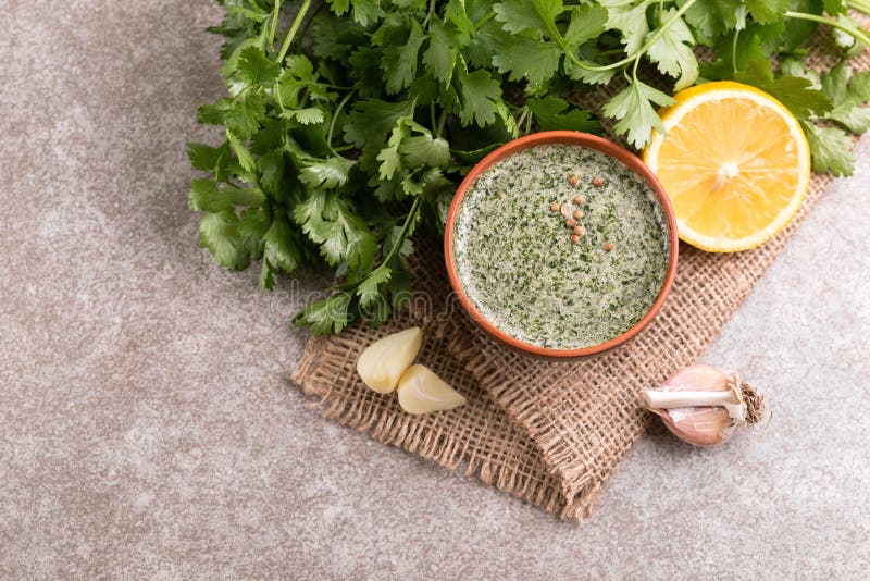 Sweet and sour green homemade sauce with cilantro, lemon and gar stock photo Sweet and sour green homemade sauce with cilantro, lemon and gar stock photo