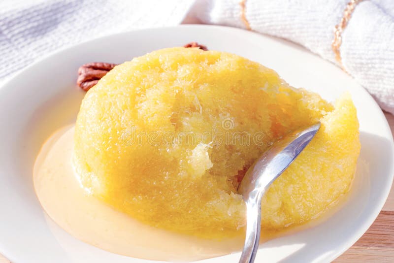 Sweet yellow Turkish dessert cheese halva Hosmerim on the white plate in the kitchen. stock photos Sweet yellow Turkish dessert cheese halva Hosmerim on the white plate in the kitchen. stock photos
