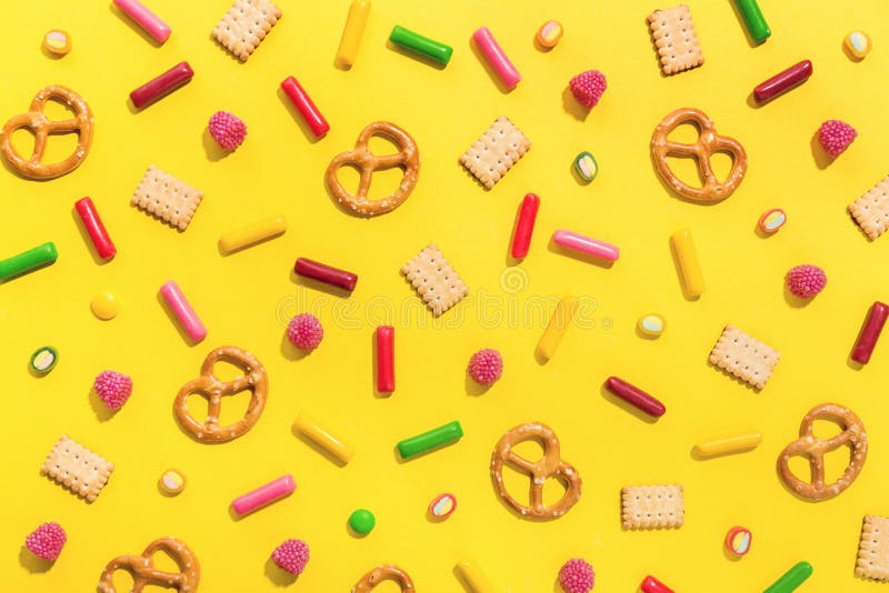 Sweets flat lay on yellow background