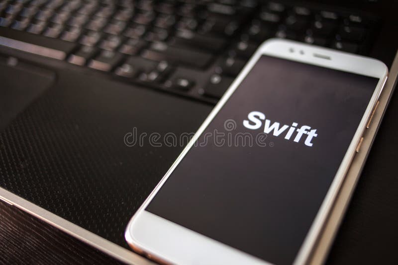 Swift Programming language for mobile development, concept. Smartphone stock images