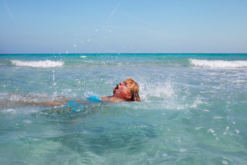 Swimmer in Mediterranean sea. stock photo
