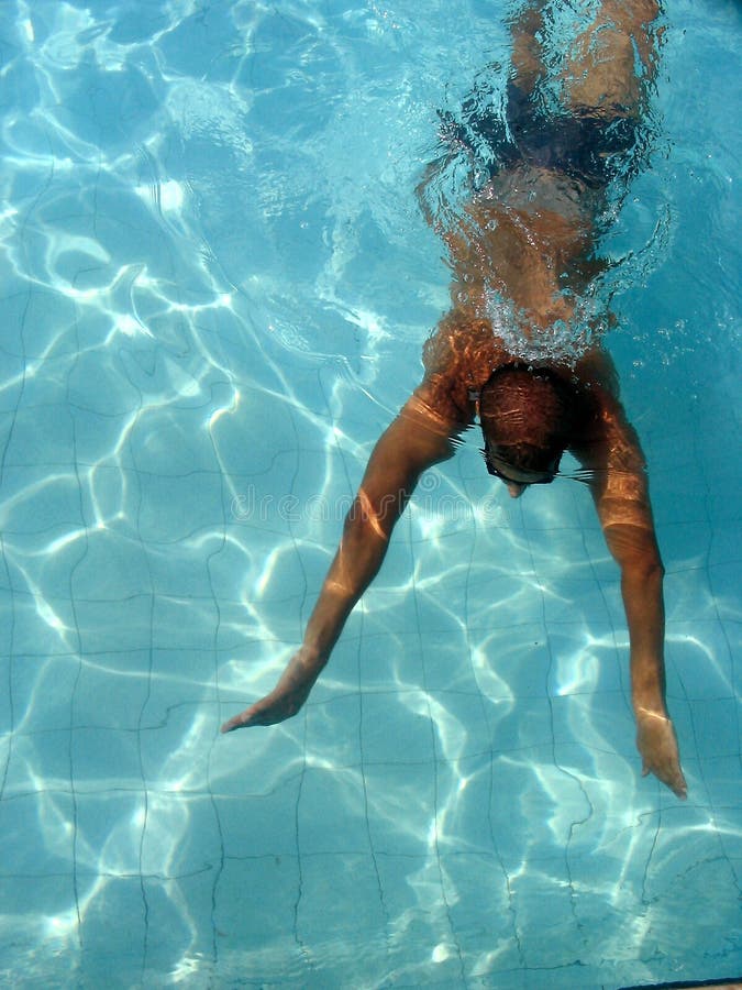 Swimmer at swimming pool stock photo