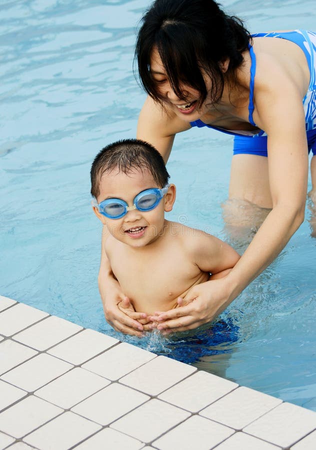 Swimming boy and mother