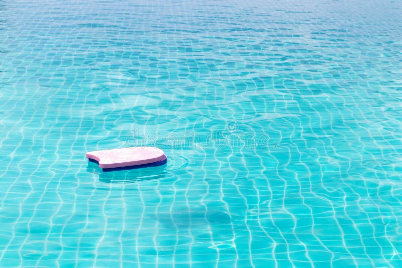 Swimming Foam Pad are Floating in the Large Swimming Pool Stock Photo