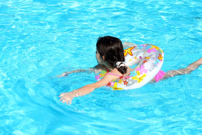 Young girl Swimming in pool. Young girl Swimming in pool