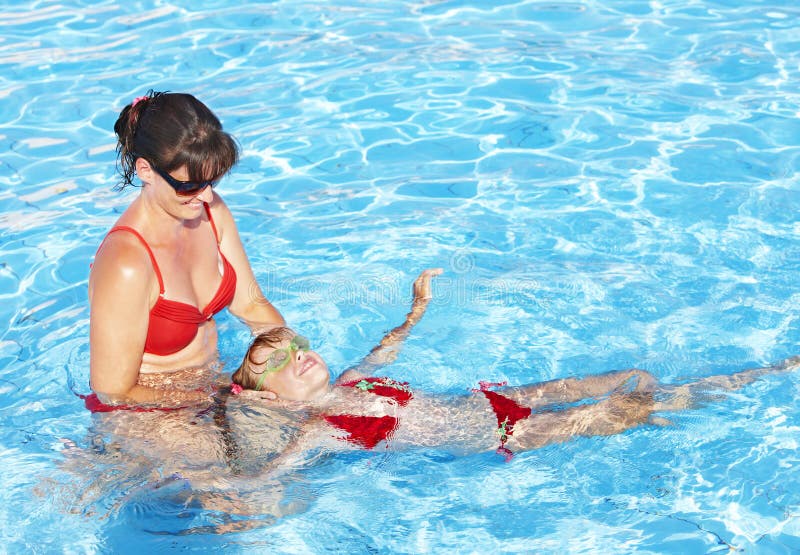 Swimming Instructor learn child swim. royalty free stock photography Swimming Instructor learn child swim. royalty free stock photography