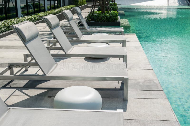 Swimming pool with beach chairs