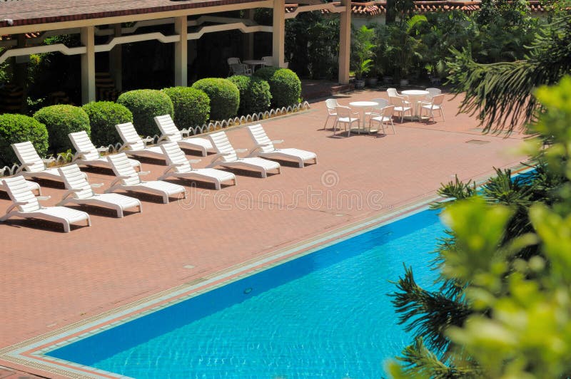 Swimming Pool and Deck Chairs Stock Image Image of armchair, blue