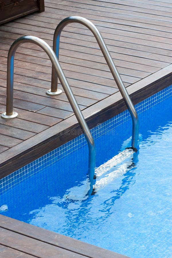 Swimming pool and handrail