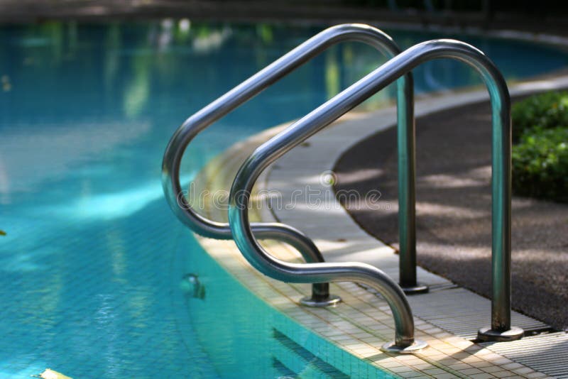 Swimming pool handrail royalty free stock image