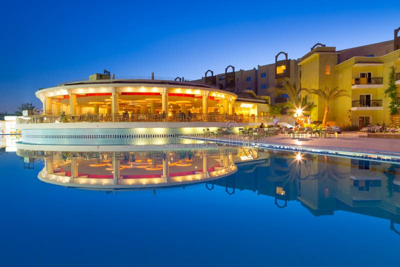 Swimming pool of tropical resort in Hurghada at night, Egypt