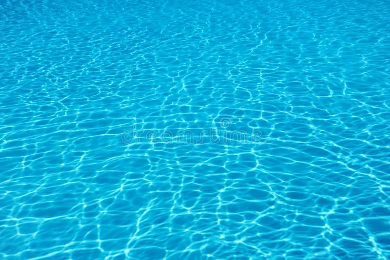 Swimming pool water sun reflection background. Ripple Water