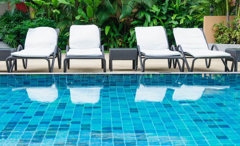 Swimming Pool With White Beach Chairs Stock Image - Image ...