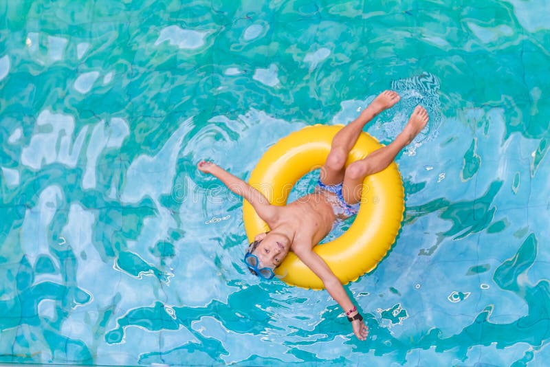 Swimming, summer vacation - child boy playing in blue wat royalty free stock images Swimming, summer vacation - child boy playing in blue wat royalty free stock images