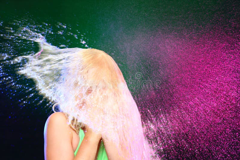 Girl with swimwear got a colorful shower. Girl with swimwear got a colorful shower