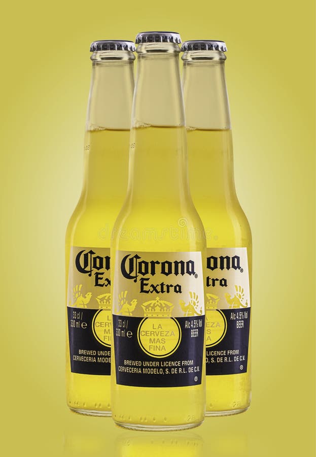 Three Corona Extra Beer Bottles on a Light Yellow Background Editorial Image Image of