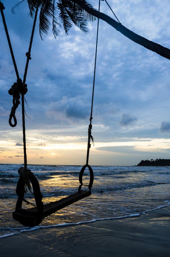 Swing on the beach stock image. Image of sundown, color 25216727