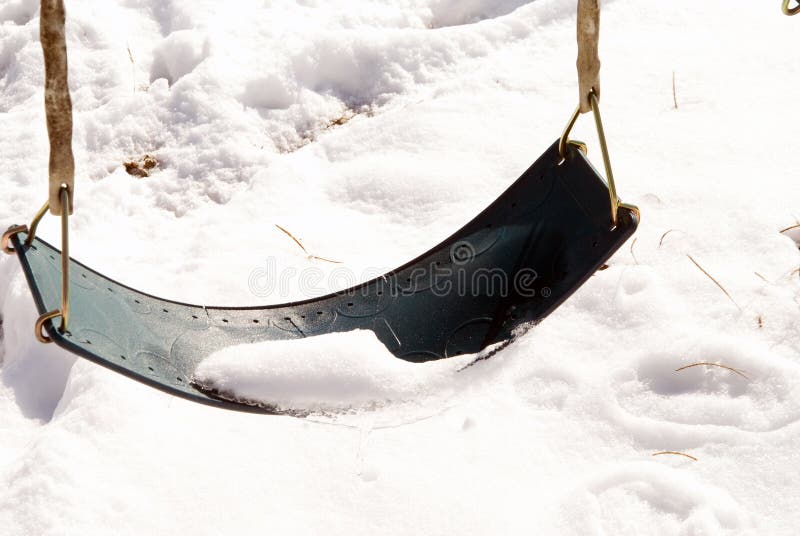 Swing Covered in Snow