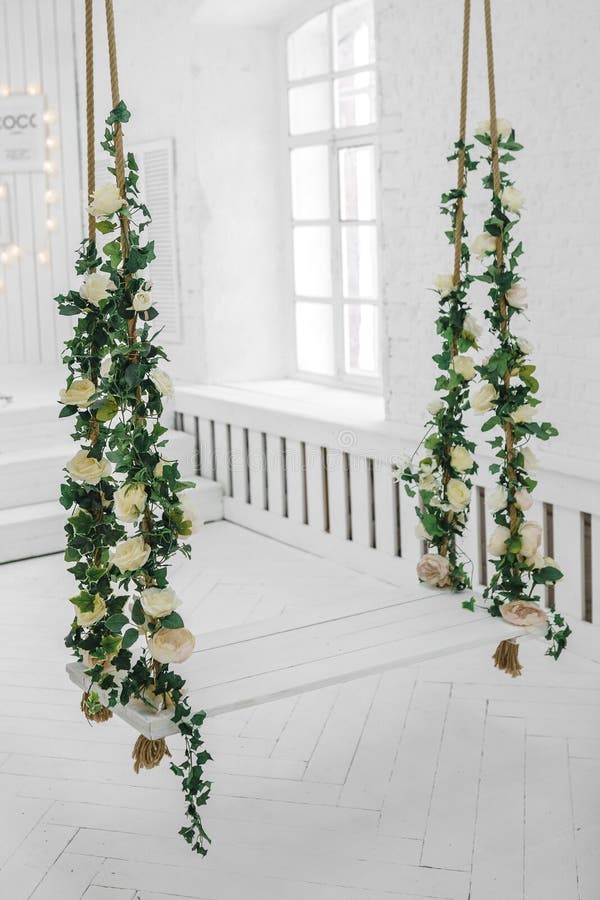 Swing decorated with artificial flowers