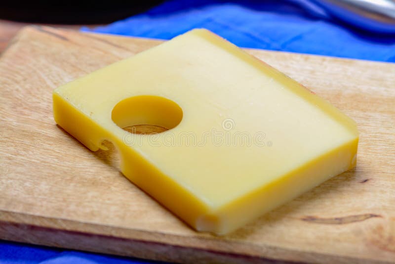 Swiss Emmental or Emmentaler Medium-hard Cheese with Round Holes Stock ...