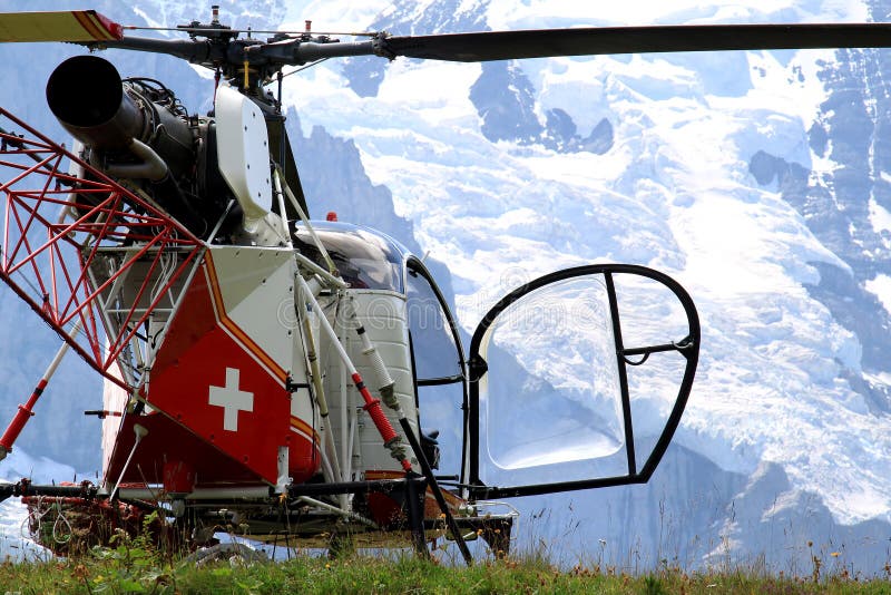 Swiss helicopter in the mounts of Bernese Oberland royalty free stock photo