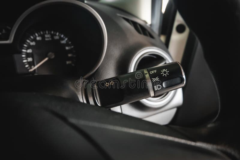 Switch Off Lights in a Car. Closeup Car Integrated Turning Indicator