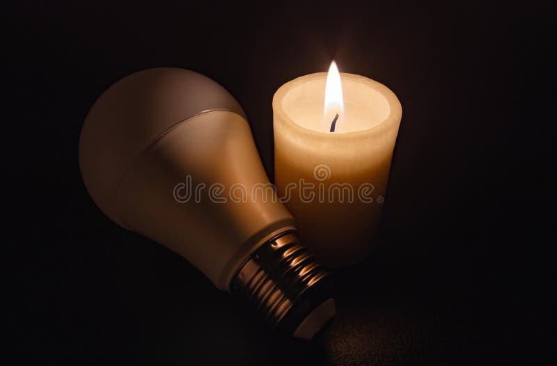 https://thumbs.dreamstime.com/b/switched-off-light-not-glowing-energy-saving-led-bulb-liying-near-burning-candle-darkness-blackout-city-electricity-off-270745620.jpg