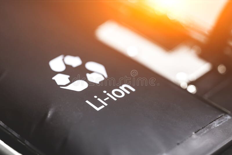 Swollen lithium-ion battery, modern smartphone, broken smartphone, battery-powered explosive electronics stock photo