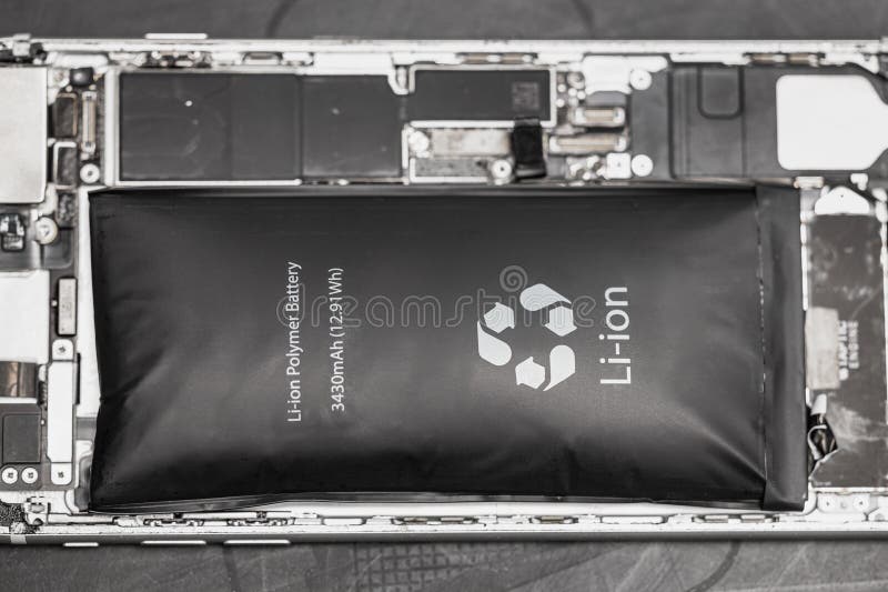 Swollen lithium-ion battery, modern smartphone, broken smartphone, battery-powered explosive electronics stock photos