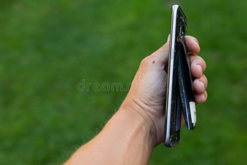 Swollen lithium smartphone battery royalty free stock image