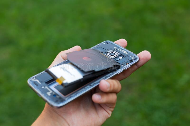 Swollen lithium smartphone battery stock photo