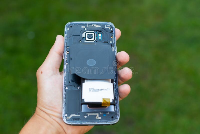 Swollen lithium smartphone battery stock image