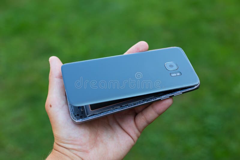 Swollen lithium smartphone battery stock photography