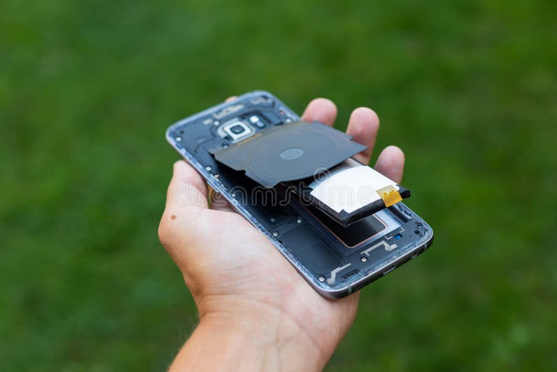 Swollen lithium smartphone battery royalty free stock image