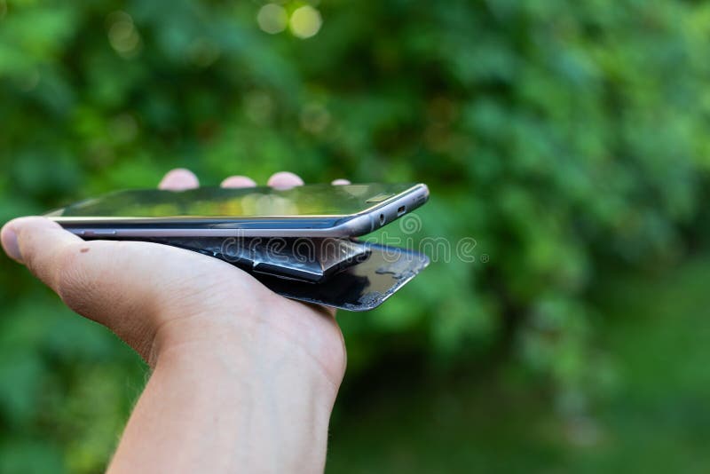 Swollen lithium smartphone battery stock photography