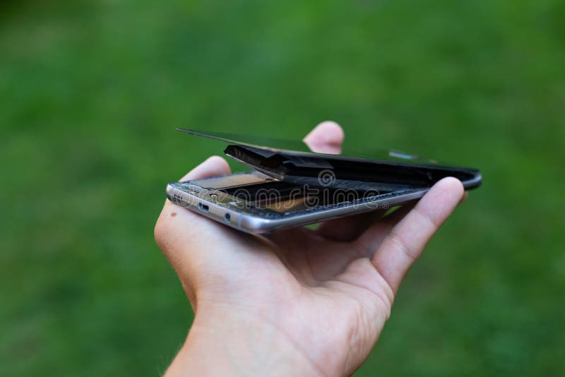 Swollen lithium smartphone battery stock photos