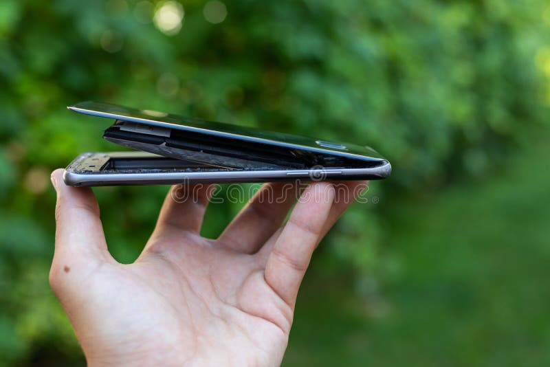 Swollen lithium smartphone battery royalty free stock image