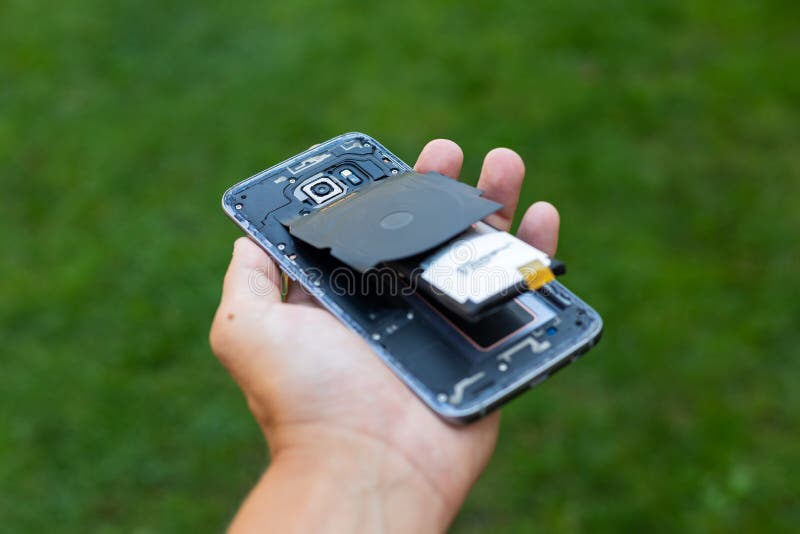 Swollen lithium smartphone battery royalty free stock image