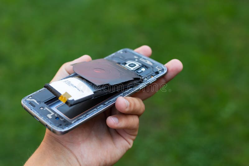 Swollen lithium smartphone battery royalty free stock photography