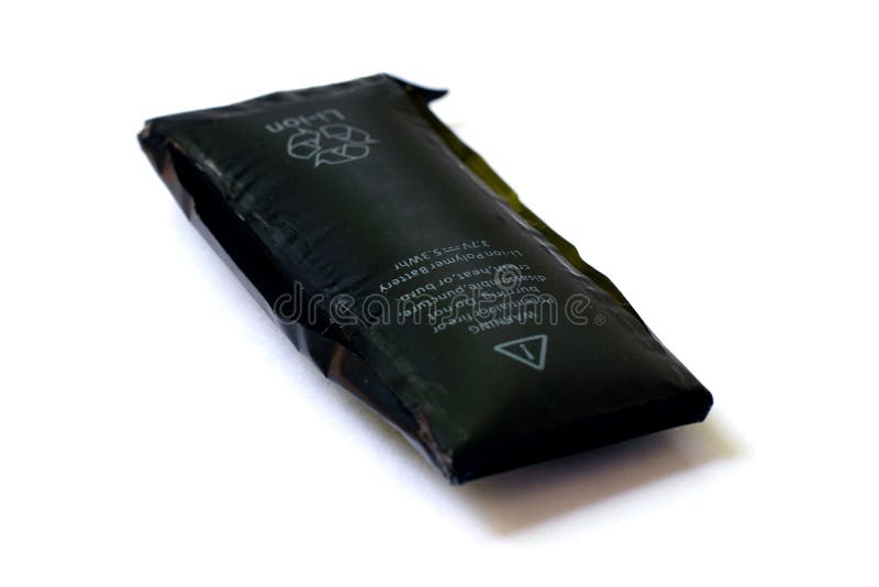 Swollen mobile phone battery royalty free stock photography