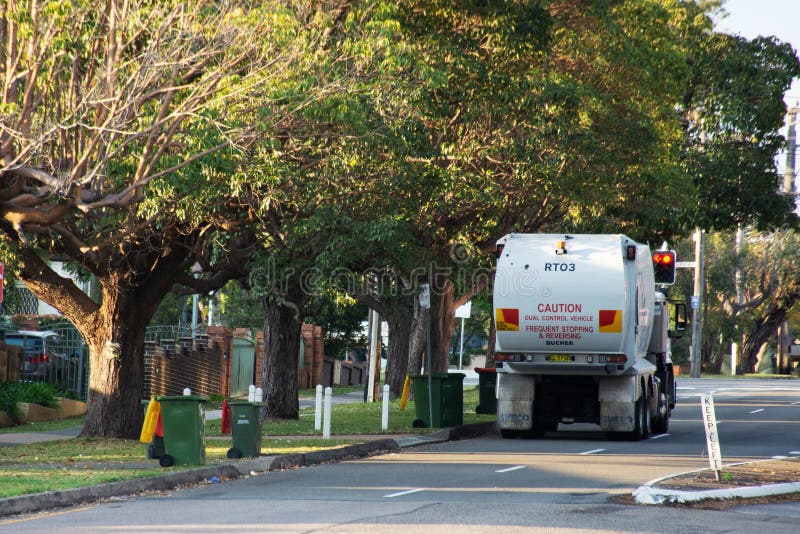 Australian garbage wheelie bins and a garbage truck on duty