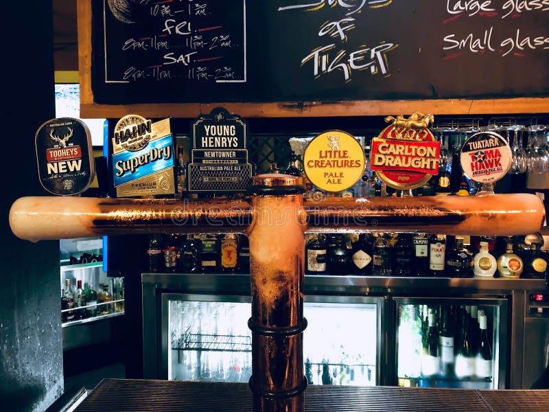 SYDNEY, AUSTRALIA - OCTOBER 3, 2018: Multiple brand draft beer dispenser and liquor bottle and many Whiskey at beautiful restauran