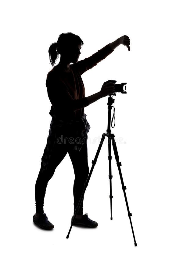 Sylwetka fotografa z kciukami w dół obrazy stock