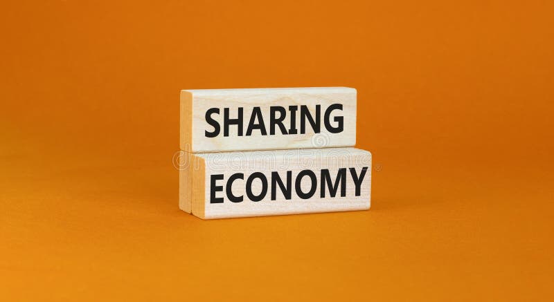 Sharing economy symbol. Concept words Sharing economy on beautiful wooden blocks. Beautiful orange table orange background. Business sharing economy concept. Copy space. Sharing economy symbol. Concept words Sharing economy on beautiful wooden blocks. Beautiful orange table orange background. Business sharing economy concept. Copy space